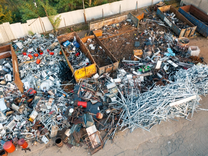 Renovation scrap bin with pipes and fittings collected from commercial buildings